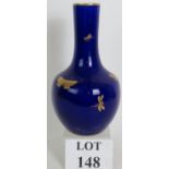 A Mintons Aesthetic movement vase with gilt butterflies on a cobalt blue ground.