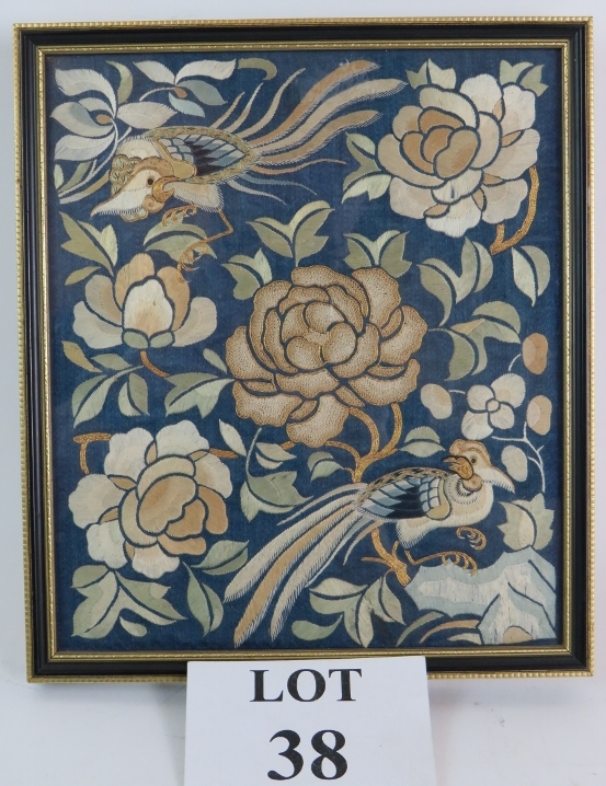 A small Chinese silk panel in glazed frame.