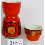 Two cool 1970's Poole pottery orange glazed vases, tallest 23cm.