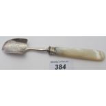 A Georgian silver monogrammed stilton scoop, with mother of pearl handle, London 1820, makers WK.