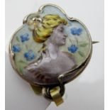 A fine Art Nouveau German enamelled brooch/pendant of a lady with forget-me-nots around her,