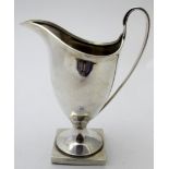 A silver helmet shaped cream jug on a square base, Chester 1926, approx weight 128 grams/4.