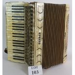 A vintage 1950's Hohner 1055 piano accordion with original straps.