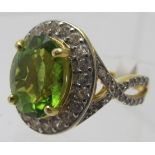 Peridot gemstone ring, 17mm x 13mm portrait setting, ring size M/N, 14k yellow gold 925.