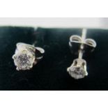 A pair of white gold diamond stud earrings, backs stamped 750 (18ct), and diamonds approx 0.