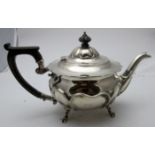 A good quality heavy silver teapot with panel decoration and paw feet, Sheffield 1907,