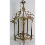 A large three branch gilt painted hall lantern. Height is 82cm plus chain.