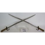 Two 19th Century French Yataghan sword bayonets with gilt brass handles.