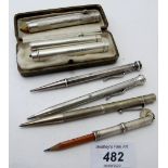 Three silver click action slide pencils, some worn hallmarks, Samson Morden,