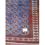 A Baluchi rug on blue ground with repeat pattern. 2.