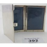 A triple folding small travelling photo frame, marked 925, good condition.