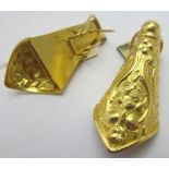 A pair of highly ornate and decorative foreign yellow metal earrings, most probably Asian,