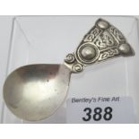 An Arts & Crafts silver caddy spoon, with Celtic type decoration, Chester 1935, good condition.