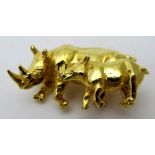 A 9ct gold hallmarked rhino brooch, mother and baby, approx 15.3 grams, indistinct makers marks.