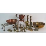 A quantity of vintage copper and brass ware including two pairs of candlesticks, bowls,