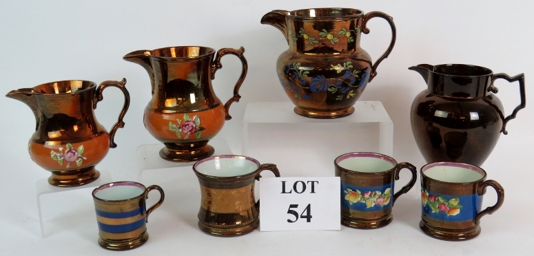 Four Victorian copper lustre ware jugs and four similar mugs, tallest is 15cm.