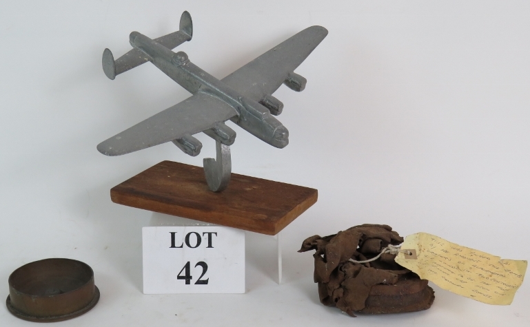 A WW2 trench art Lancaster Bomber cast in aluminium, wingspan 31cm,