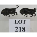 A pair of early 20th Century cold painted bronze bulls, 9cm and 10cm long.
