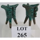 Two antique Chinese ritual jue green tripod wine vessels, in the Ming style.