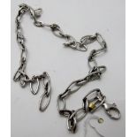 A stylish elliptical-link white metal necklace, believed to be 9ct white gold,