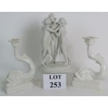 A pair of Italian white ceramic classical dolphin candlesticks, height: 22cm,