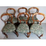 A set of six walnut framed 19th century balloon back dining chairs upholstered in a good quality