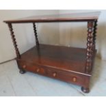 A 19th Century low whatnot side table with barley twist supports and having two small drawers to