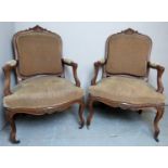 A fine pair of 19th Century French Louis XV style walnut framed Fauteuil armchairs with upholstered