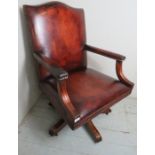 A fine 20th Century Gainsborough swivel office armchair upholstered in a burgundy leather with