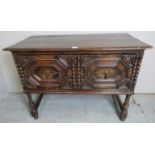 A 19th Century Jacobean style oak sideboard with a long deep single frieze drawer with geometric