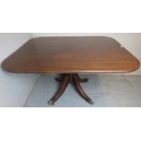 A Regency period mahogany tilt top breakfast table with a bulbous turned column over splayed legs