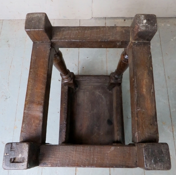 A 17th Century and later country oak joint stool with a carved linen fold frieze over turned - Image 6 of 8