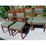 A set of six Victorian dining chairs upholstered in a good quality green tweed material with brass