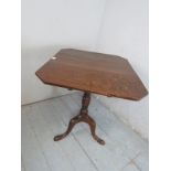 A 19th Century oak tilt top occasional table with a turned column and splayed legs.