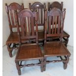 A set of five late 17th / early 18th Century oak dining / hall chairs with solid seats over turned