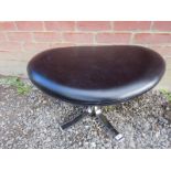 A vintage chrome and black leather stool, in good condition.