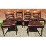 A set of six mahogany framed Georgian dining chairs with brown leather upholstered seats.