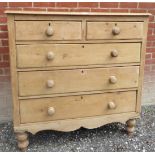 A 19th Century Pine chest of drawers with two short over three long drawers all with bun handles