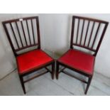 A pair of 19th Century oak framed occasional chairs with red leather upholstered drop in seat pads.