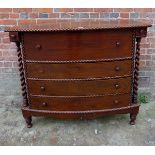 A 19th century continental bow fronted Secretaire chest with a fitted top fall front drawer over