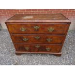 An excellent quality Georgian walnut chest of three long graduated drawers having brass lock