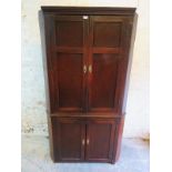A 19th Century large freestanding oak corner cupboard with double panelled doors to top and bottom