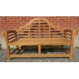 An excellent quality teak garden Lutyens style bench.