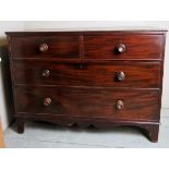 A 19th Century mahogany chest of two short over two long graduated deep drawers with ring turned