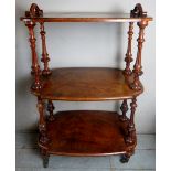 A fine quality 19th Century walnut three tier whatnot with decorative carved upright supports and