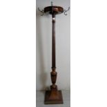 A 19th Century mahogany coat stand with a fluted column and terminating on a pedestal base.