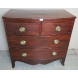 A 19th Century mahogany bow fronted chest of two short over two long drawers with brass handles.