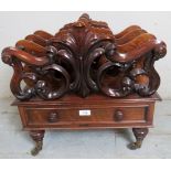 A fine quality Victorian rosewood Canterbury with a single drawer with ring turned handles over