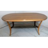 A mid-century Ercol coffee table with a black glass lower shelf, bearing stamp to underside.