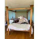 A 19th Century carved oak four poster bed with battlement design end supports and having an